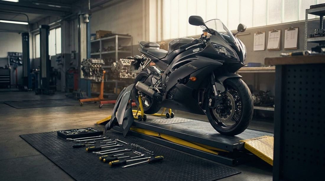 A motorcycle on a workshop stand with a side panel off